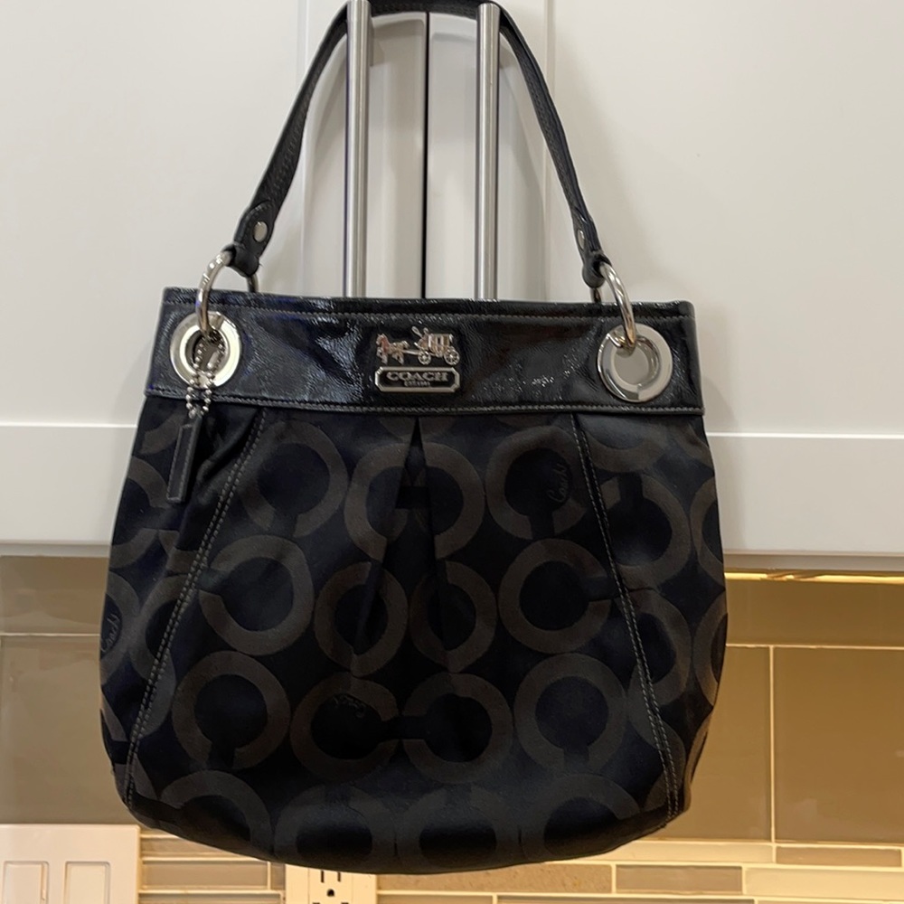 Coach black signature purse. Shoulder carry with metal grommets patent leather